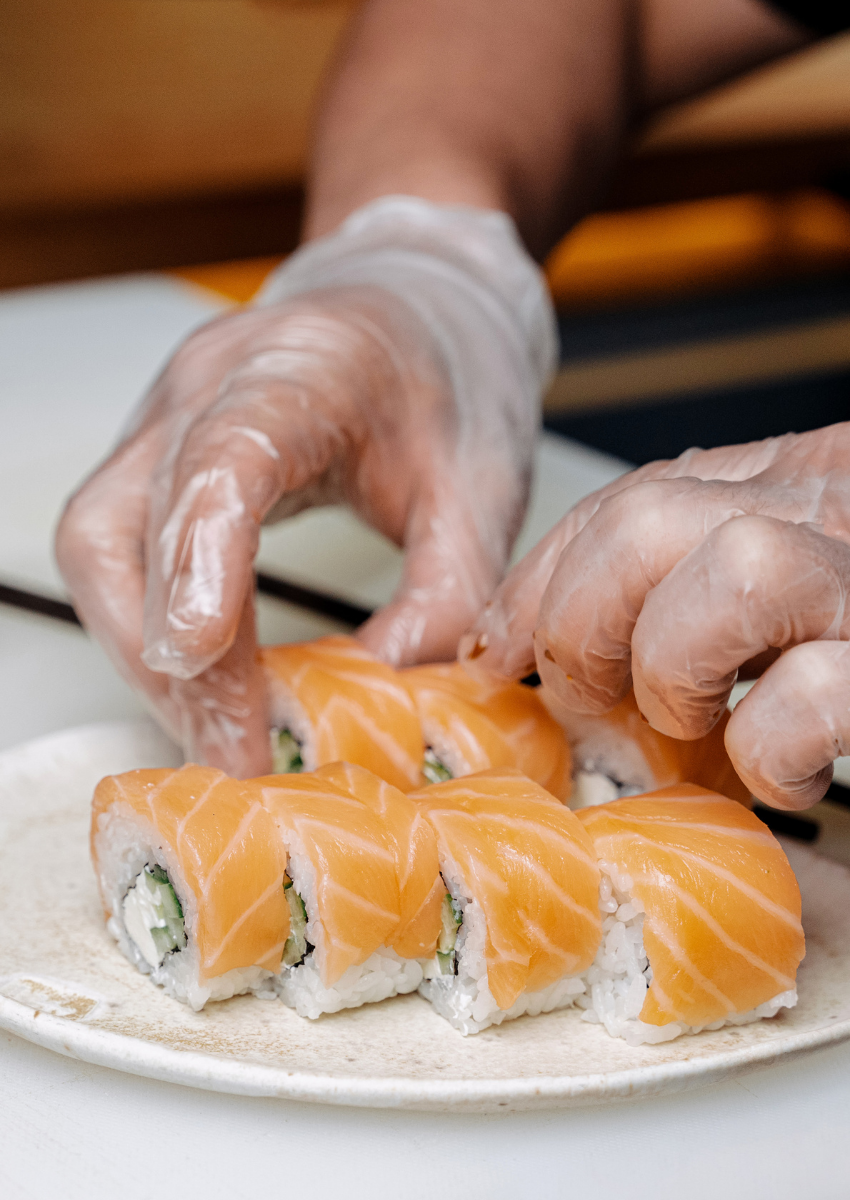 NYC sushi chef preparing fresh fish for live station event