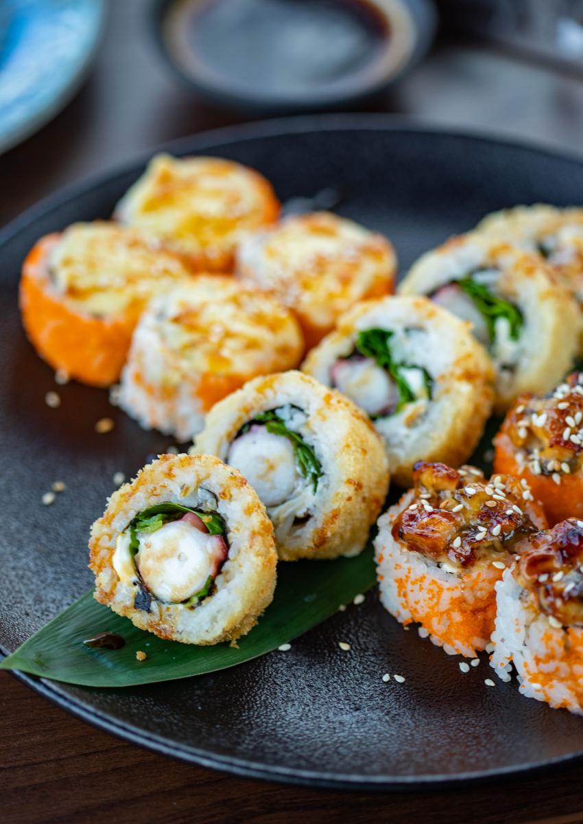 Chef preparing specialty rolls at Queens private event